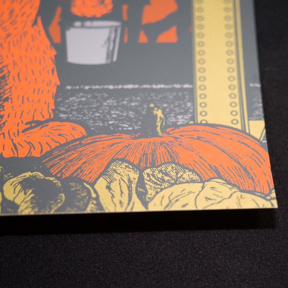 close up of justin helton dead and company concert poster with pumpkin