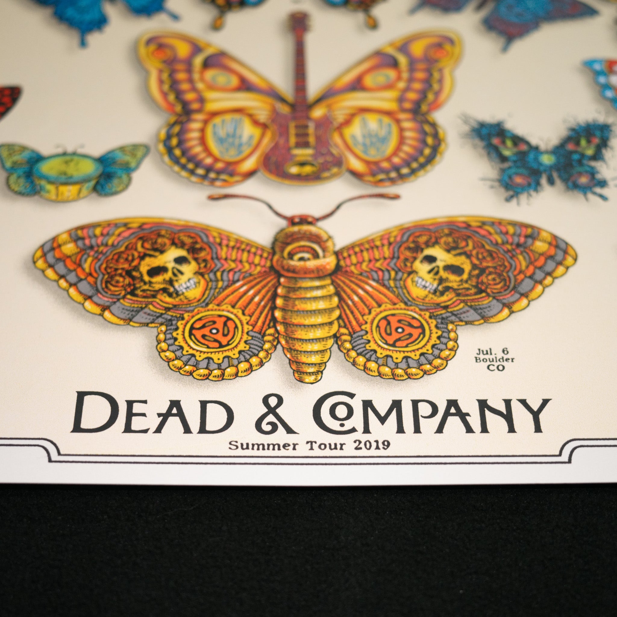 close up of emek dead and company poster with words "dead and company summer tour 2019"