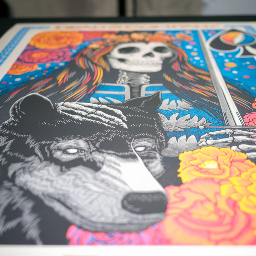 close up of john vogl dead and company poster with wolf and skeleton