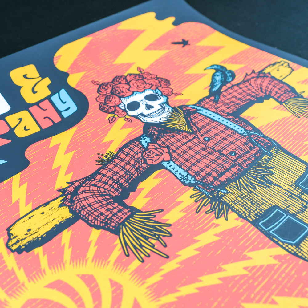 close up of justin helton dead and company concert poster with scarecrow skeleton 