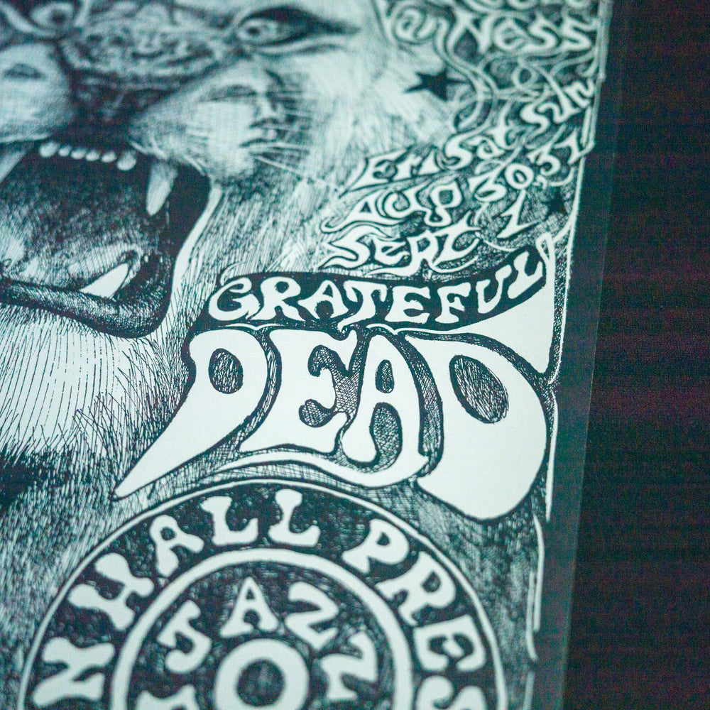 close up of lee conklin grateful dead concert poster with words "grateful dead"