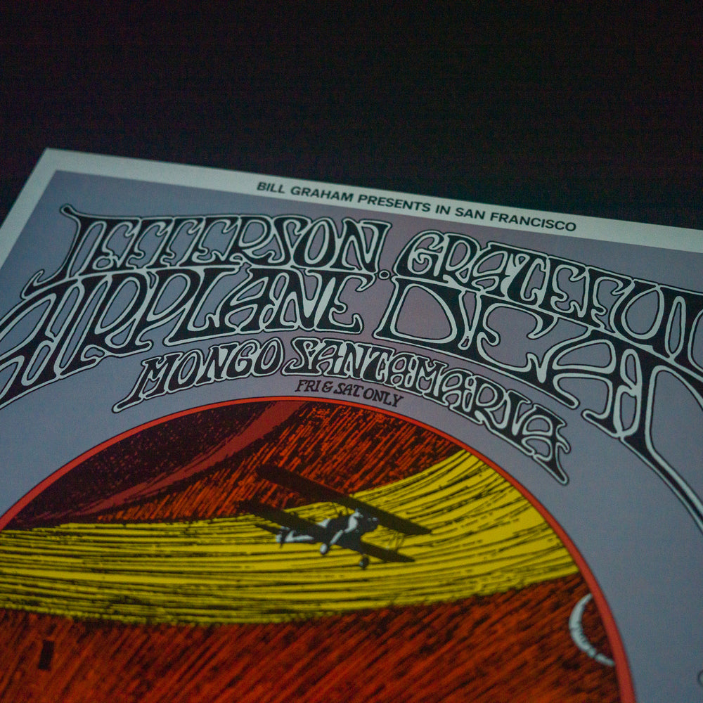 close up of Randy Tuten Jefferson Airplane and GratefulDead 1969 SanFrancisco Concert Poster with plane and red asnd yellow background