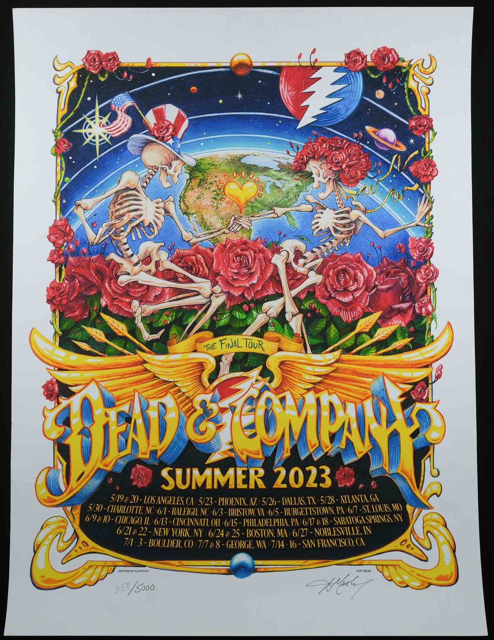 Dead and Company poster with white trim showing two skeletons dancing on a bed of roses